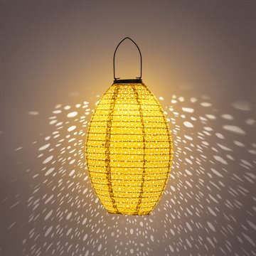 Dekorativ oval solcellelampe i i perforeret stof, i gylden orange farve CB739184